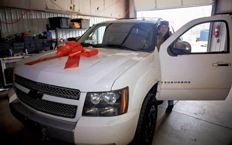 Car show client receiving an early Christmas present!
