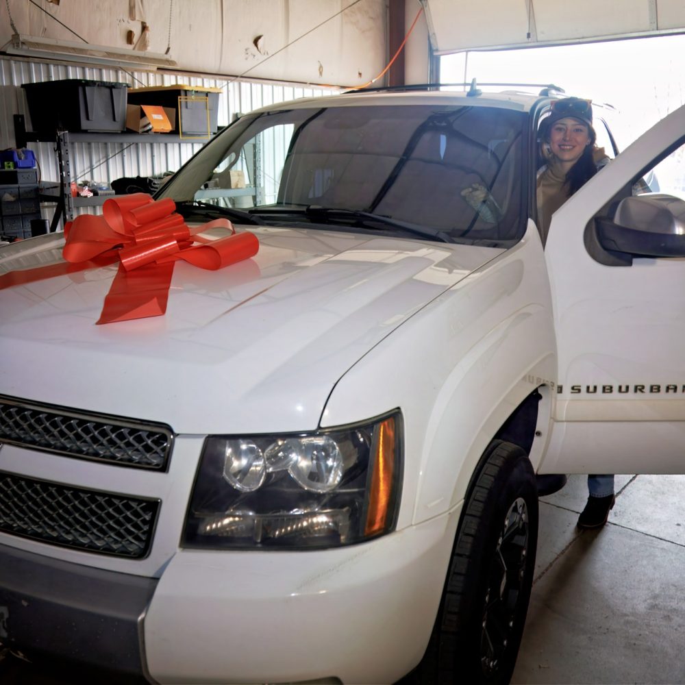 Car show client receiving an early Christmas present!